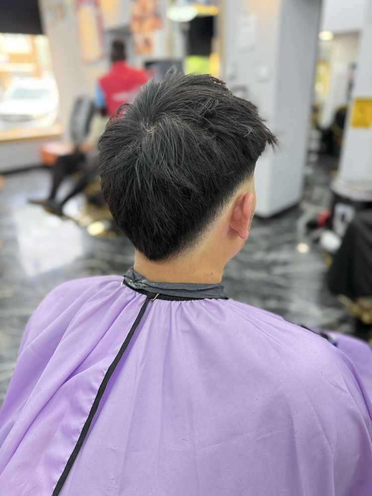Textured cut with a clean taper at the neckline, seen from the back